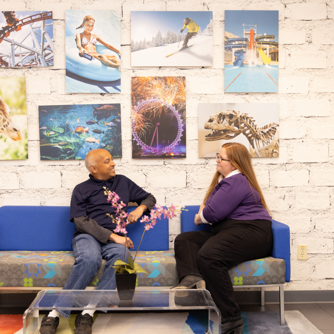 Man and women sitting on bench