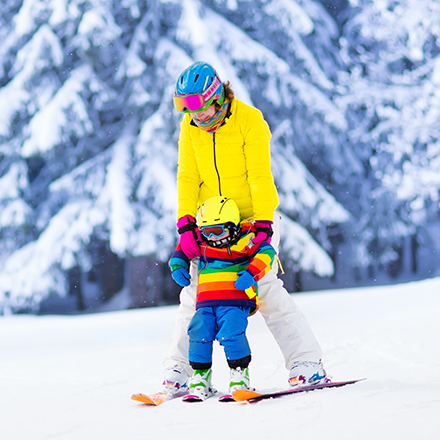 Parent and child skiing