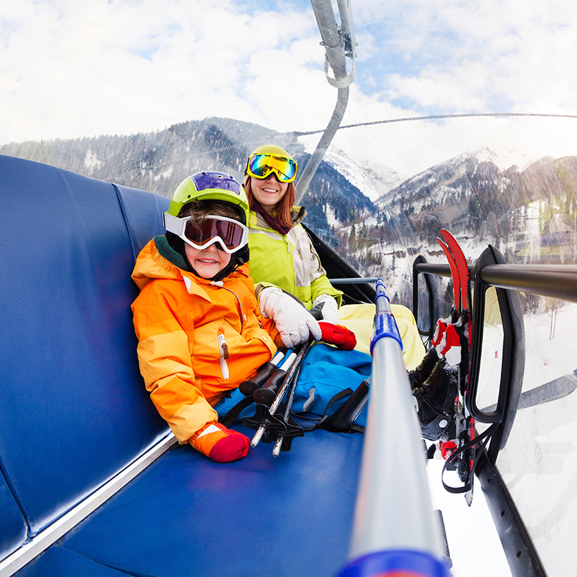 Two people on a ski lift