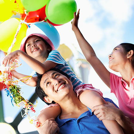 Child on parent's shoulders